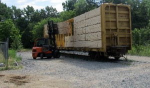 PRICE LUMBER EMPLOYEE LOADING RAILROAD CAR ON THE JACKSON STREET TRACK CROSSING. PRICE LUMBER WOULD BE ABLE TO USE THE INDUSTRIAL PARK'S PROPOSED PUBLIC ACCESS AREA TO LOAD RAIL CARS.