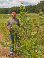 OLYMPUS DIGITAL CAMERA Graduate student Umesh Chaudhari with a four-month-old cottonwood tree