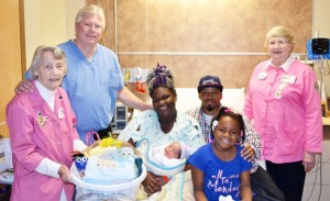 (L to R) are Monteene McCoy, Dr. Kelly Shrum, mother Kenise Bryant holding baby Korneal, father Robert Washington, sister Kamiah, and Leta Taylor, president of the DMH Auxiliary.
