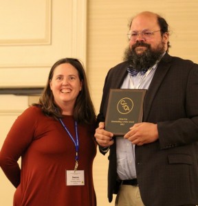 Dr. Adam Key accepts the 2023 CSCA’s Journal of Communication Pedagogy Article of the Year Award at the organization’s conference in April. (Photograph by Aubrey Chastain.)